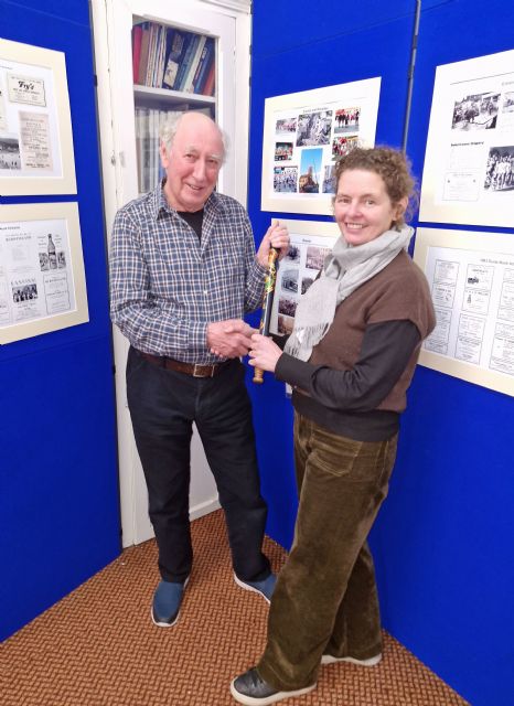 Antonia Laurence Allen presenting Ian Archibald with baton